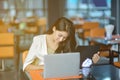 Young attractive Asian business woman sleeping, drowsing or taking a nap at her desk, Tired business woman accountant with bills Royalty Free Stock Photo