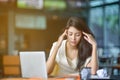 Young attractive Asian business woman sleeping, drowsing or taking a nap at her desk, Tired business woman accountant with bills Royalty Free Stock Photo