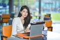 Young attractive Asian business woman sleeping, drowsing or taking a nap at her desk, Tired business woman accountant with bills Royalty Free Stock Photo