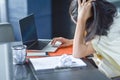 Young attractive Asian business woman sleeping, drowsing or taking a nap at her desk, Tired business woman accountant with bills Royalty Free Stock Photo