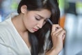 Young attractive Asian business woman sleeping, drowsing or taking a nap at her desk, Tired business woman accountant with bills Royalty Free Stock Photo