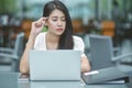 Young attractive Asian business woman sleeping, drowsing or taking a nap at her desk, Tired business woman accountant with bills Royalty Free Stock Photo