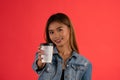 Young attractive asian girl offering coffee