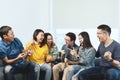 Young Attractive asian group of friends talking and laughing with happy in gathering meeting sitting at home