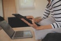 Young attractive asian woman resting using browsing tablet computer on sofa at home, happy girl sitting on couch relax reading Royalty Free Stock Photo