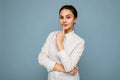 Young attractive beautiful thoughtful brunette woman with sincere emotions wearing casual srtriped white shirt isolated Royalty Free Stock Photo