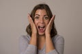 Young attractive and beautiful woman screaming excited and happy in nice shock and surprise showing positive and fun Royalty Free Stock Photo