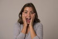 Young attractive and beautiful woman screaming excited and happy in nice shock and surprise showing positive and fun Royalty Free Stock Photo