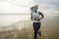 Young attractive black girl post quarantine jogging - new normal running workout of athletic and fit African American woman at Royalty Free Stock Photo