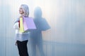 Portrait of young happy smiling woman with shopping bags Royalty Free Stock Photo