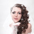 Young attractive bride in wedding dress sends a kiss Royalty Free Stock Photo