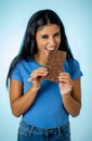 Young attractive brunette feeling joy and guilt at the thought of eating chocolate Royalty Free Stock Photo