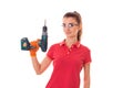 Young attractive brunette woman builder in uniform with glasses and drill in her hands make reovations isolated on white Royalty Free Stock Photo