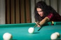 Young attractive brunette woman playing billiards Royalty Free Stock Photo