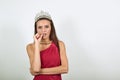 Indecisive Female Holds A Finger Near Her Lips And Hesitates. Human Doubt Royalty Free Stock Photo