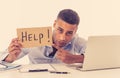 Young attractive business man feeling stressed at work asking for help Royalty Free Stock Photo