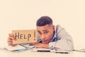 Young attractive business man feeling stressed at work asking for help Royalty Free Stock Photo