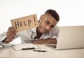 Young attractive business man feeling stressed at work asking for help Royalty Free Stock Photo