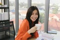 Young attractive business woman drinking coffe at her desk Royalty Free Stock Photo