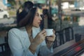 Young attractive business woman having coffee in coffee shop Royalty Free Stock Photo