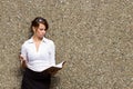 Young attractive business woman with her notebook journal Royalty Free Stock Photo