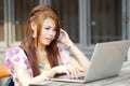 Young attractive business woman working on her laptop at outdoor Royalty Free Stock Photo