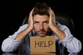 Young attractive businessman in worried tired and stressed face expression sitting depressed on office chair