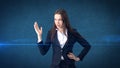 Young attractive businesswoman portrait in suit with standing and hand up, isolated studio background with copyspace. Royalty Free Stock Photo