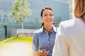 Young attractive businesswoman talking to her colleague Royalty Free Stock Photo