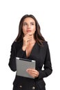 Young attractive businesswoman wearing formal suit is standing, holding tablet Royalty Free Stock Photo