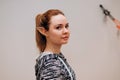 Young attractive Caucasian blonde woman with long elf ears looking at camera. Halloween corporate office party, lifestyle headshot Royalty Free Stock Photo