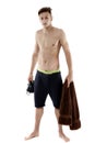 Young attractive caucasian man swimmer with goggles and towel is Royalty Free Stock Photo