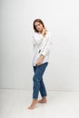 young attractive caucasian woman with long brown hair in shirt, blue jeans Royalty Free Stock Photo
