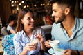 Young attractive couple on date in coffee shop Royalty Free Stock Photo