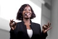 Young attractive and confident black African American business woman with headset speaking in auditorium at corporate training Royalty Free Stock Photo