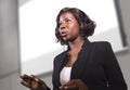 Young attractive and confident black African American business woman with headset speaking in auditorium at corporate training Royalty Free Stock Photo