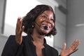 Young attractive and confident black African American business woman with headset speaking in auditorium at corporate training Royalty Free Stock Photo