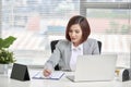 Young, attractive and confident business woman working in office Royalty Free Stock Photo