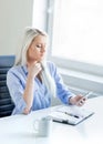 Young, attractive and confident business woman working in office Royalty Free Stock Photo