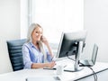 Young, attractive and confident business woman working in office Royalty Free Stock Photo