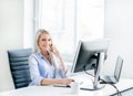 Young, attractive and confident business woman working in office Royalty Free Stock Photo