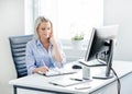 Young, attractive and confident business woman working in office Royalty Free Stock Photo