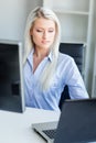 Young, attractive and confident business woman working in office Royalty Free Stock Photo