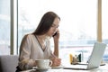 young attractive confident successful woman business woman talking on the phone and making notes in notebook sitting at a table i Royalty Free Stock Photo