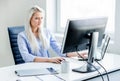 Young, attractive and confident woman working in office Royalty Free Stock Photo