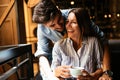 Young attractive couple on date in coffee shop Royalty Free Stock Photo