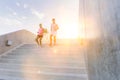 Young attractive couple exercising in stairs