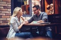 Young attractive couple flirting in cafe Royalty Free Stock Photo
