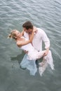 Young attractive couple flirting in pool of water Royalty Free Stock Photo