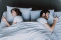 Young Attractive Couple Having Problem in Bed Royalty Free Stock Photo